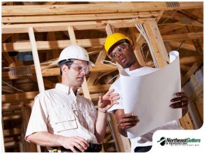 5280-1618204141-two-contractors-going-over-the-construction-plans-for-a-roof-replacement.jpg