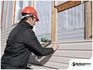 5280-1620623605-light-colored-siding-being-installed.jpg