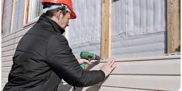 5280-1620623605-light-colored-siding-being-installed.jpg